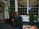 Gen. Petraeus tries out one of the chairs dedicated in loving memory of his father, Sixtus Petraeus.