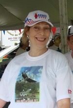 Sue Fink, who helped hang the exhibits, also produced the 4th of July t-shirts modeled here. 