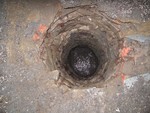 Once the asphalt was removed, you could see down into the stone-lined well.