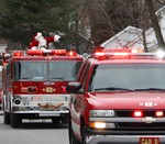 Santa and his escort from the fire company.