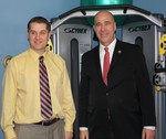 Brett Wells and Congressman Hall in the physical therapy room.