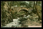 An old postcard shows the stone arch bridge.