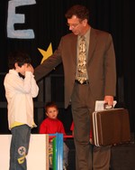 Principal Ken Schmidt re-assures this boy that it is ok to cry.