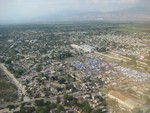 A view of the blue tarps where people are find shelter.