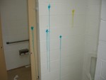 Paintballs were fired on the walls of the public restroom.
