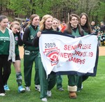 The senior softball players presented their championship banner.