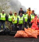Members of the CCAC and the Scout troop pose with some of the trash the picked up.