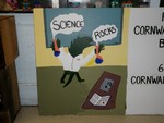 Students painted these signs to encourage voting on the school budget.