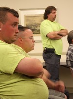 Wayne Yeoman, standing, and other DPW employees listened as the mayor tried to address their concerns.