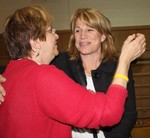 DIana McNally is greeted by a supporter after she won the school board seat.