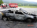 Police say this car was set on fire in an alleged insurance scam attempt.