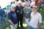 State senator Bill Larkin chats with pet show judges Father Paul, Kevin Quigley and Joseph Gross.