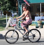 Melissa Stoffa joined the parade on her bicycle.