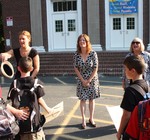COHES Principal Gail Wehmann (center) welcomes the students with teaching assistant Karen Reilly and teacher Diana Jacques.