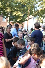 Parents and children crowded onto the front lawn of the elementary school.
