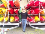 Kris Seiz and some of the kayaks operated by SKAT.