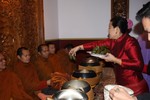 A Thai woman fed the monks after the chanting session.