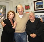 Maureen Moore, right, says that she has gotten feedback from her friend and fellow photographer Tom Doyle, center, pictured with his wife, Barbara.