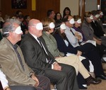 The school board members sat blindfolded to imagine how it felt to be a middle school student.