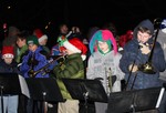 The middle school band played lively Christmas carols for the crowd at Highland Engine Co.