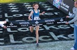 Aisling Cuffe crosses the finish line to win the Footlocker Cross Country National Championship.
