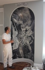 Co-owner Gerardo Castro puts finishing touches on his mural, Arte et Labore.