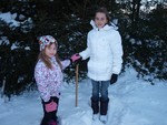 Emma and Samantha incognoli helped their father measure the snowfall on Wednesday. 
