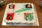 The cake featured the ensigna of the four colleges chosen by the athletes.