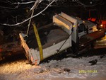The truck's rear wheels went into the sink hole.