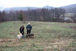 Stacey Pskowski and Councilman Clark with their dogs near the proposed site of the dog park.