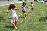 The final three contestants in one of the hula-hoop contests.