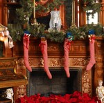 A mantel decorated for Christmas from one of their holiday books.