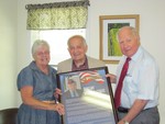 Senator Bill Larkin (R-C, Cornwall-on-Hudson) presents William and Joyce Stratis with a framed picture and biography honoring his nomination to the NYS Senate Veterans' Hall of Fame.