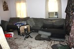 The living room, where the sofas were soaked and electronic equipment destroyed.