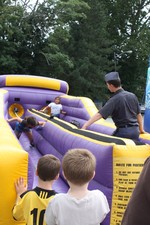 A NYMA cadet assisted children on the bungee ride.
