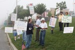 Postal workers rallied on Tuesday in support of keeping jobs locally.