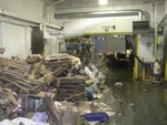 Debris is piled high inside Superior Packing after the flood in August.