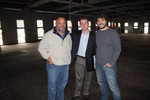 Charlie Benedetti, Paul Halayko and Christopher Botto inside the space that will be transformed into a micro-brewery and tasting room.
