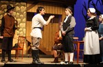 John Proctor defends his wife's innocence to Reverend Parris.
