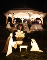 A nativity sits in front of the village bandstand.