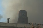 The mill's tower engulfed in smoke.  Photo by Maureen Moore.