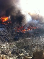 The fire engulfed one of the buildings in the rear of the Mill Street complex of warehouses and businesses.  Photo by Doreen Brodmerkel.