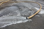 Water hoses filled with ice created a problem for firefighters.