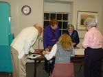 Election officials tally the votes
