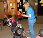 Nature museum educator Vicky Rubio shows the children a box turtle.