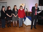 Ladies Auxiliary members (l to r) Dawn Hogan Mary Lulves, Gladys Pacenza, Carol O'Keefe are recognized by SKFE president Doug Vatter.