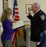 The new village police chief, Steven Dixon, is sworn into office on Tuesday afternoon.