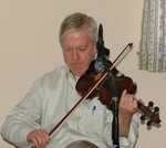 Brian Conway on fiddle in concert on March 25th.