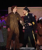Officer Lockstock confronts Bobby Strong.
