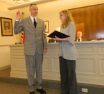 James Kane takes the oath of office Monday.
